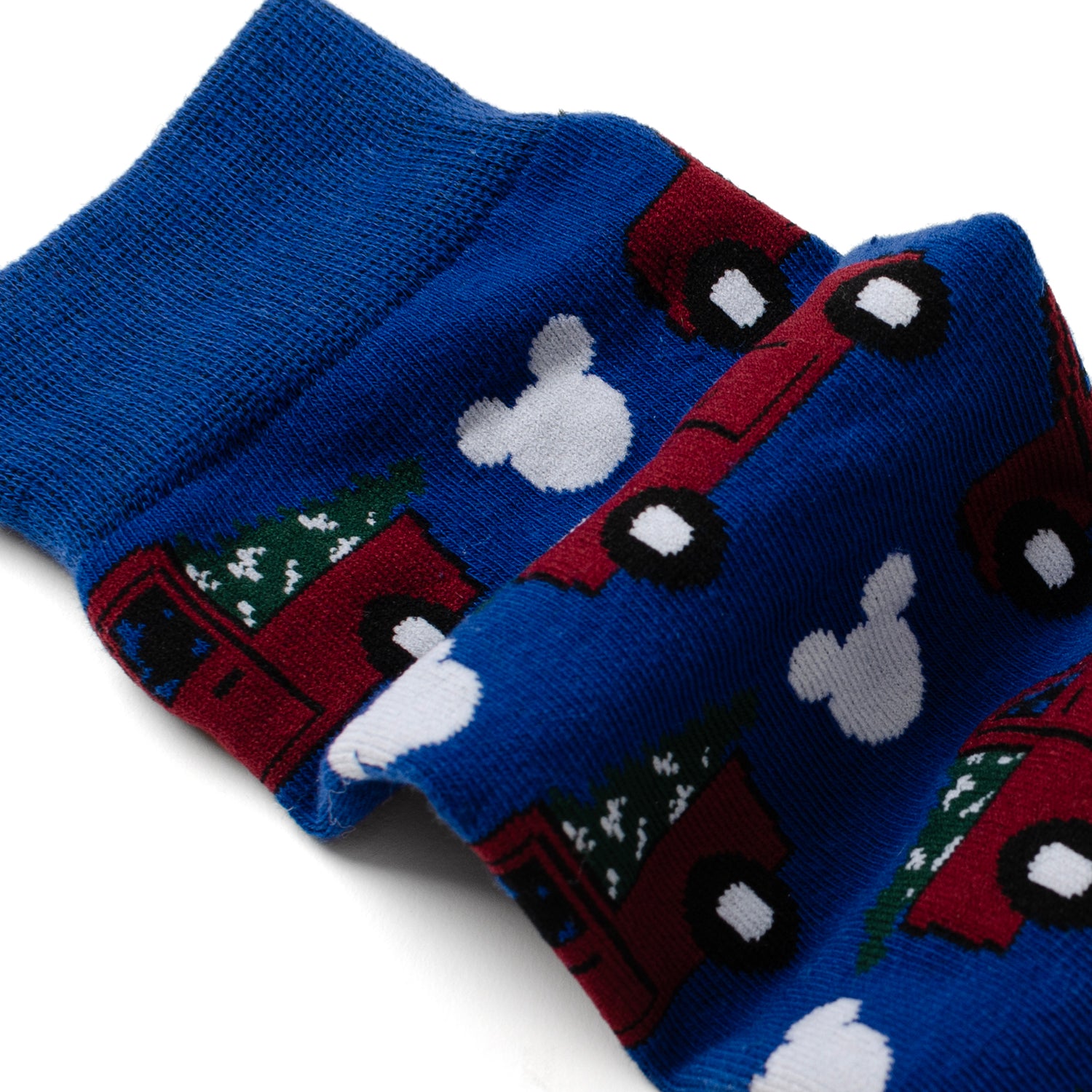 Celebrate Disney style with the Mickey Holiday Truck Navy Sock and Mickey Blue Lapel Pin Gift Set. Featuring premium navy socks adorned with a festive Mickey Mouse holiday truck pattern and a sophisticated enamel lapel pin in a striking blue hue showcasing Mickey Mouse, this set seamlessly blends whimsy and elegance. The socks, crafted from a soft, breathable cotton blend, offer comfort and durability, while the meticulously designed pin adds a distinctive touch to any outfit. Image 4
