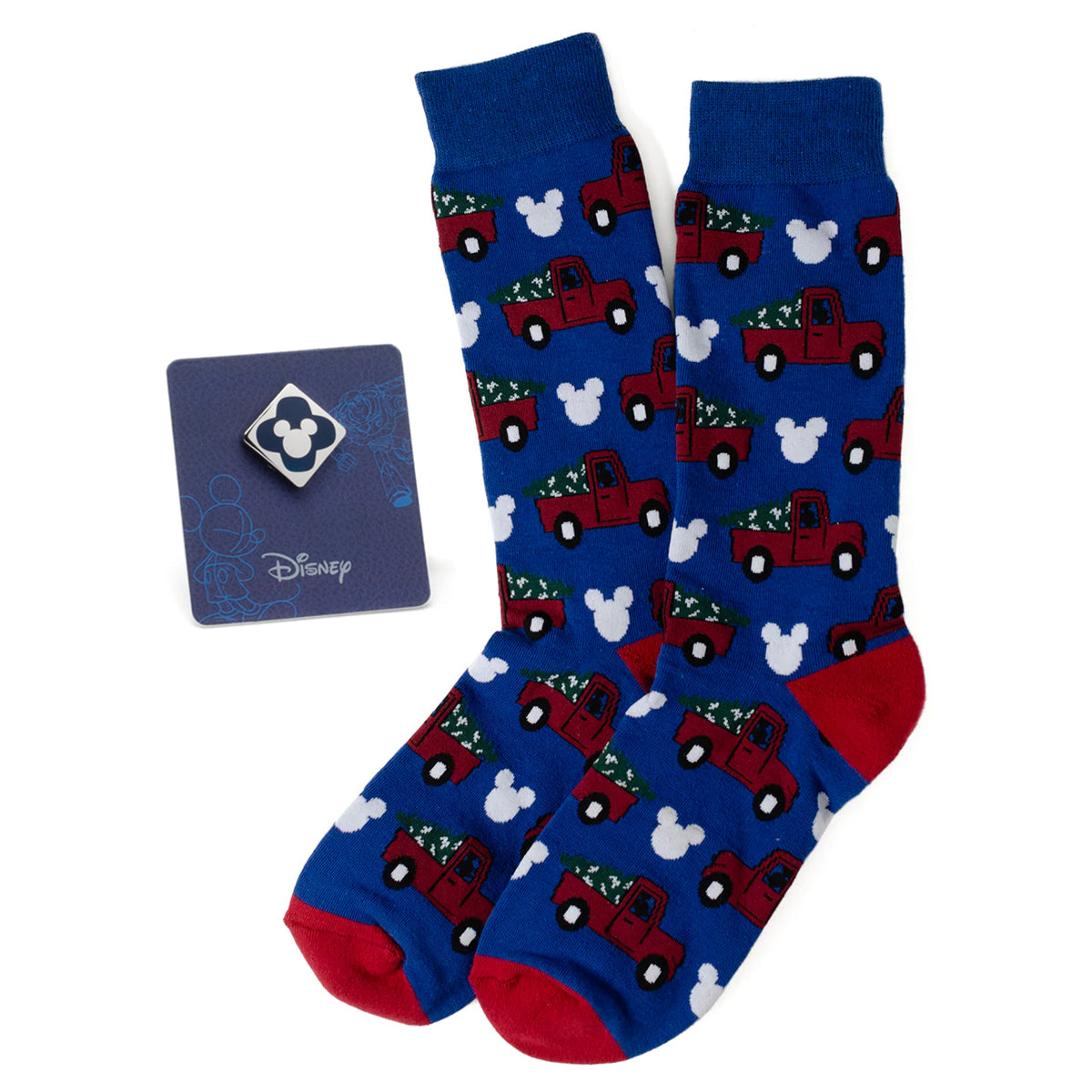 Celebrate Disney style with the Mickey Holiday Truck Navy Sock and Mickey Blue Lapel Pin Gift Set. Featuring premium navy socks adorned with a festive Mickey Mouse holiday truck pattern and a sophisticated enamel lapel pin in a striking blue hue showcasing Mickey Mouse, this set seamlessly blends whimsy and elegance. The socks, crafted from a soft, breathable cotton blend, offer comfort and durability, while the meticulously designed pin adds a distinctive touch to any outfit. Image 1
