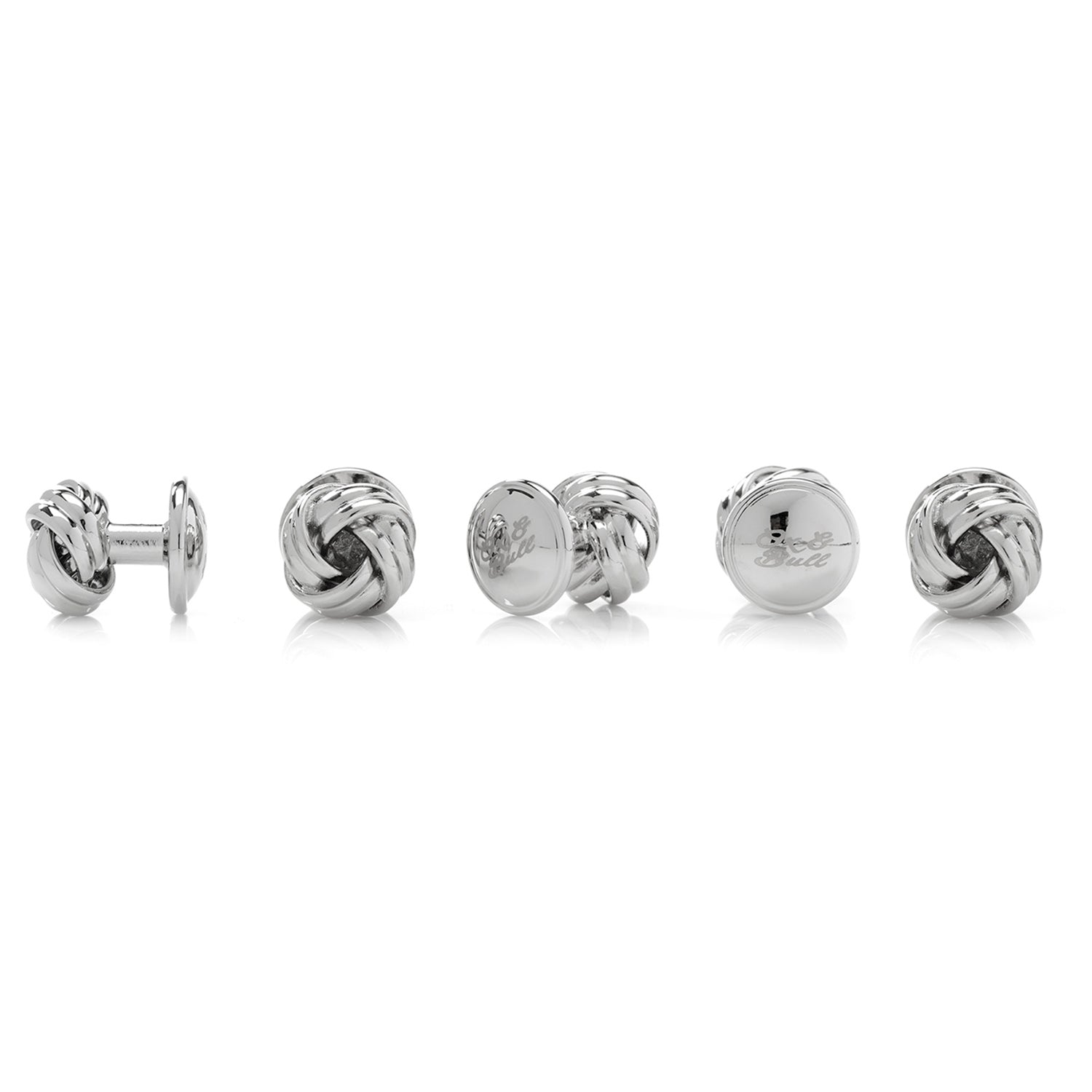 A classic knot design with an elegant silver tone finish, the Silver Knot Stud Set features a pair of cufflinks and matching tuxedo studs that are the perfect accessories for formal events. A popular item for weddings year-round, keep the groom and his groomsmen looking sharp on your big day. Pair with a black bow tie for an elegantly classic look that never goes out of style. Image 3