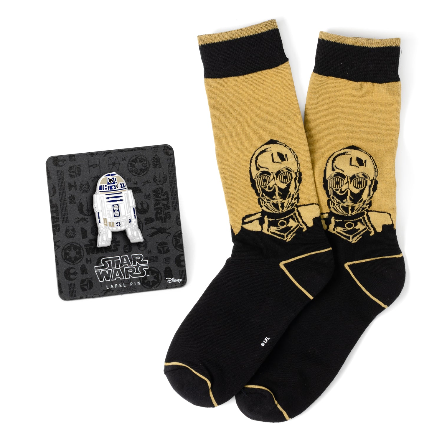 Celebrate the iconic droid duo with the R2D2 and C3PO Black Gift Set. This charming set includes a pair of black and yellow socks featuring the beloved C3PO, along with our R2D2 Lapel Pin. Perfect for the Star Wars fan who cherishes these classic characters, these accessories add a touch of nostalgic elegance to any outfit. Showcase your love for the galaxy's favorite droids with every step and detail. Image 1
