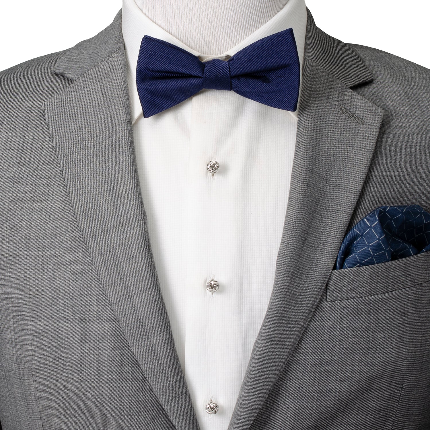 A classic knot design with an elegant silver tone finish, the Silver Knot Stud Set features a pair of cufflinks and matching tuxedo studs that are the perfect accessories for formal events. A popular item for weddings year-round, keep the groom and his groomsmen looking sharp on your big day. Pair with a black bow tie for an elegantly classic look that never goes out of style. Image 2