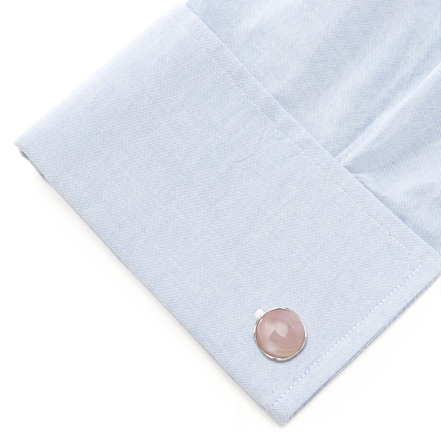 Beautiful creamy pink mother of pearl has been cut into a cushioned disc and surrounded in shiny sterling silver, to create this elegant set of cufflinks and tuxedo studs. Cufflinks feature round logo swivel closures for ease of dressing, and the studs have soft-edged fixed backings to keep them in place all night long. Perfect for any spring or summer formal occasions. Includes gift box. Image 6