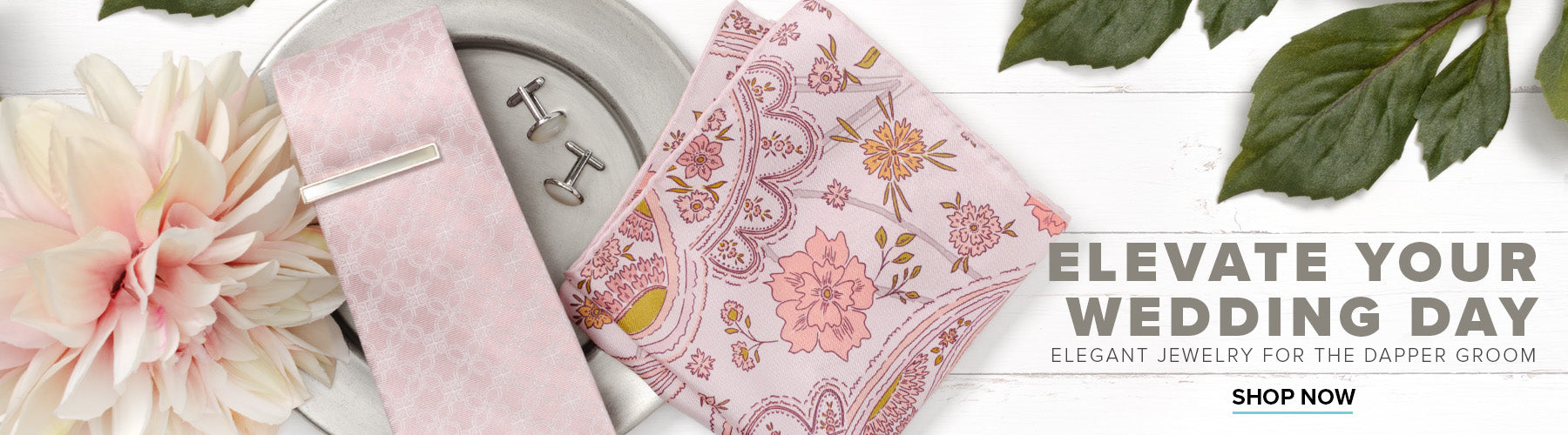 Pink wedding accessories set with tie, pocket square, cufflinks, and tie bar.